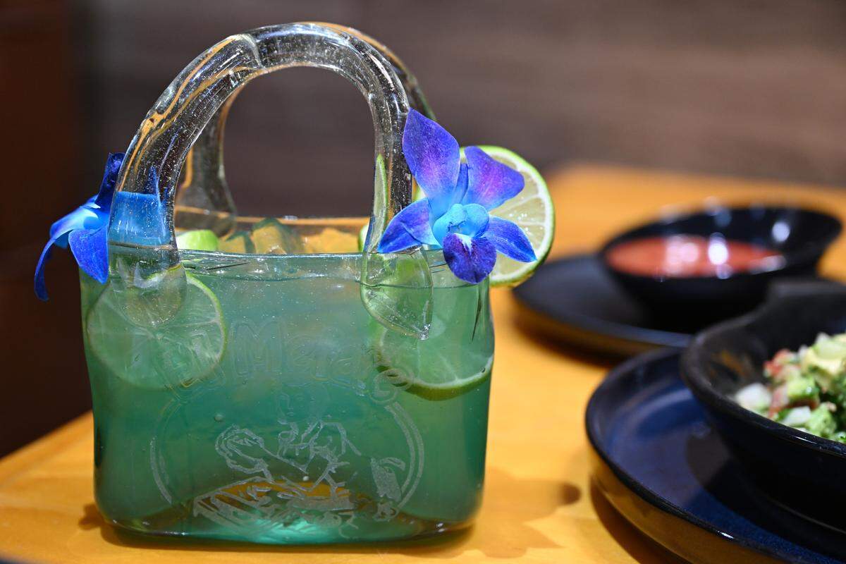 The “CutesyRita” margarita comes in a purse shaped drink glass at the new El Metate Cantina Mexican in Perry, Georgia. The “CutesyRita” is the restaurant’s signature drink that’s made with Casa Amigos tequila with blueberry flavor.