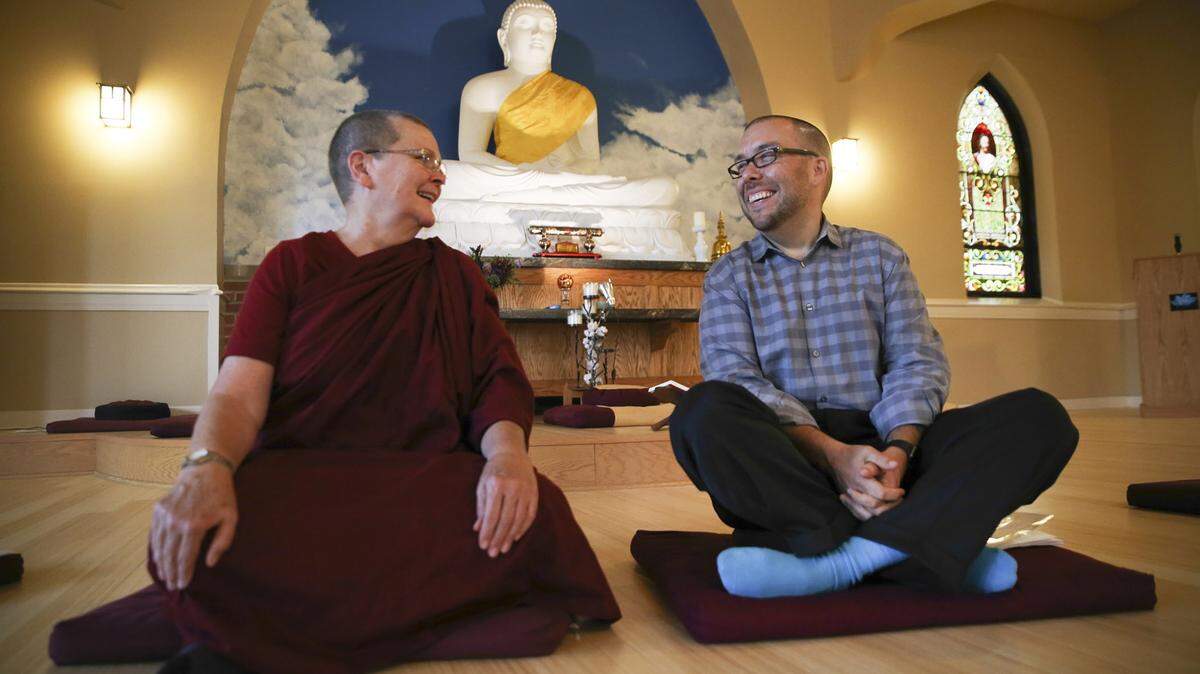 NUCCIO DINUZZO/CHICAGO TRIBUNEBhikkhuni Vimala, left, and Tyler Lewke chat in the Blue Lotus Buddhist Temple in Woodstock, Illinois, in September. Buddhist groups can offer lessons in meditation and other teachings to help lead people to sobriety.