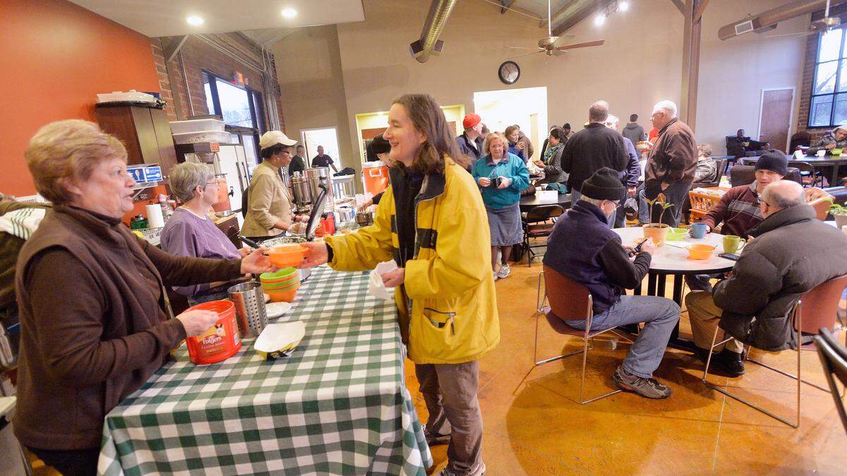 JASON VORHEES/THE TELEGRAPH Macon, GA, 02/28/2014: 
 Grits are served at Daybreak to participants in the Greater Macon Sleepout. The event was a fundraiser for Daybreak and used to increase the awareness of homelessness in Macon.