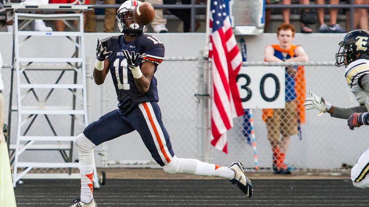 Northside's Jaylan Sandifer catches a touchdown pass in the first quarter of their game Friday night against Evans.