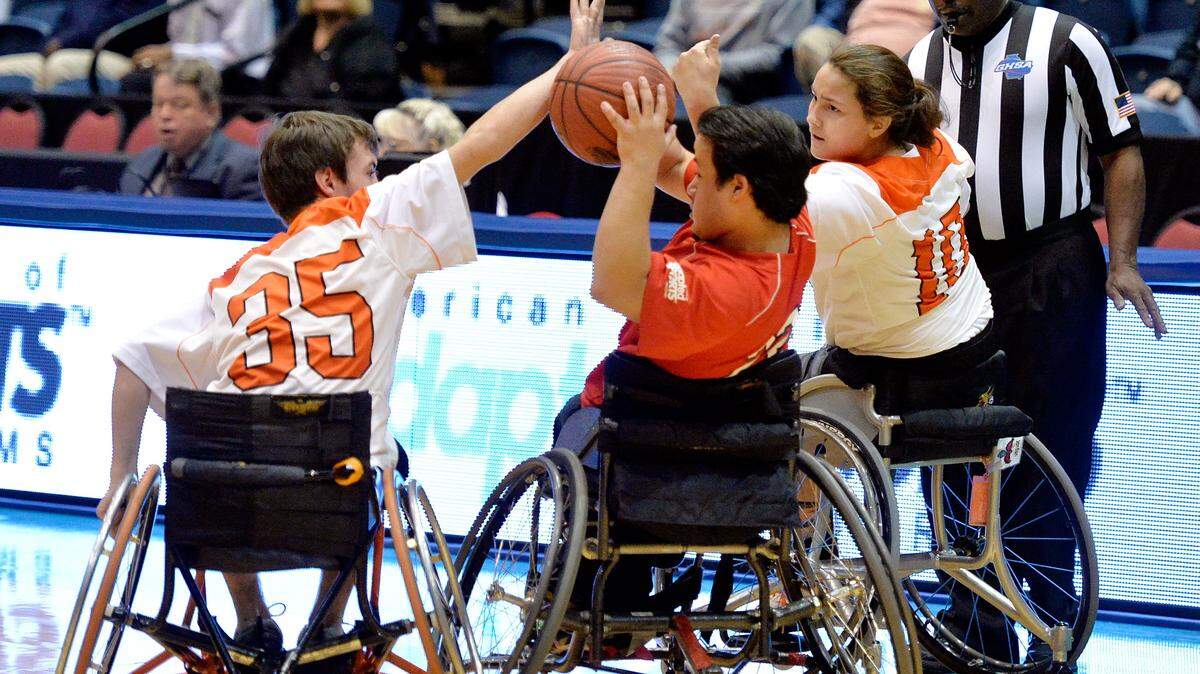 JASON VORHEES/THE TELEGRAPH Macon, GA, 03/04/2016: 
 Houston County Sharks' Grady Hilburn (35) and Jordan Kozloski (10) pressure the Gwinnett Heat's Derek Claros (22) during their American Association of Adapted Sports Program state championship game Friday at the Macon Coliseum.
