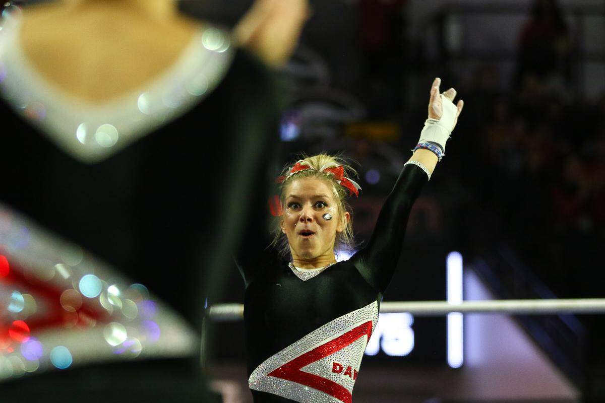 Georgia’s Rachel Dickson reacts to a clean landing following her bars routine during a gymnastics meet between the University of Georgia and University of Arkansas in Stegeman Coliseum in Athens, Ga., on Friday, Feb. 1, 2019.