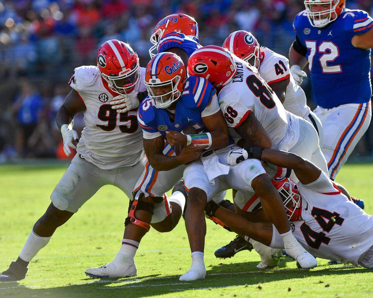The Georgia defense sacks Florida quarterback Anthony Richardson in action Saturday in Jacksonville.