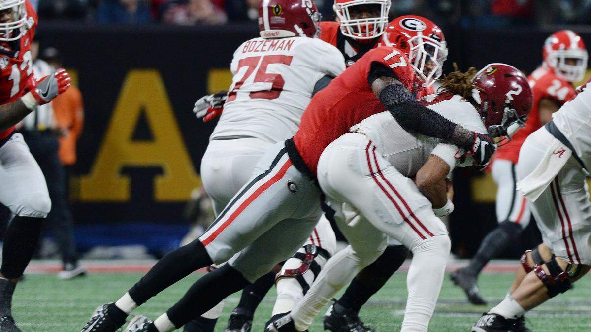Georgia linebacker Davin Bellamy sacks Alabama quarterback Jalen Hurts during second quarter action.