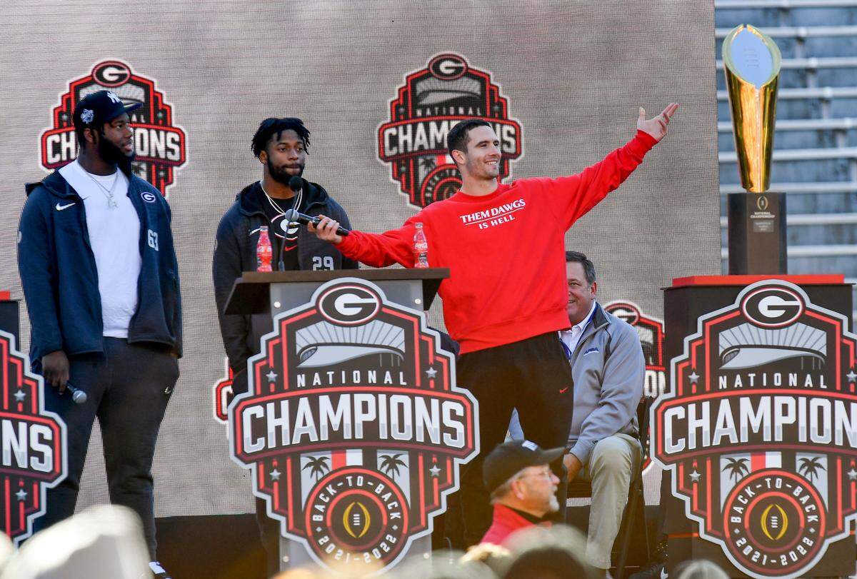 Georgia quarterback Stetson Bennett acknowledges the crowd gathered in Athens Saturday during the Bulldogs’ National Championship celebration.