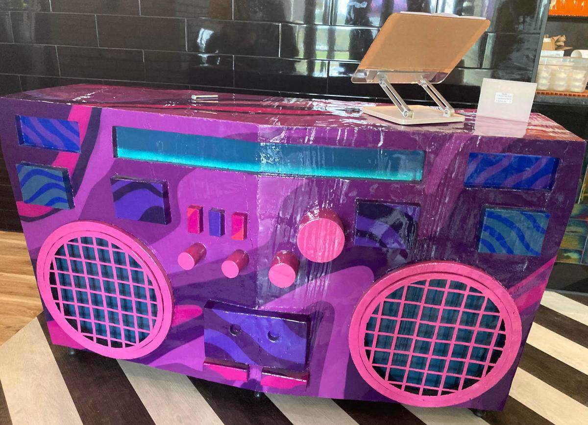 New reception desk that’s designed as a giant boombox at Mellow Mushroom in Warner Robins after a remodel.