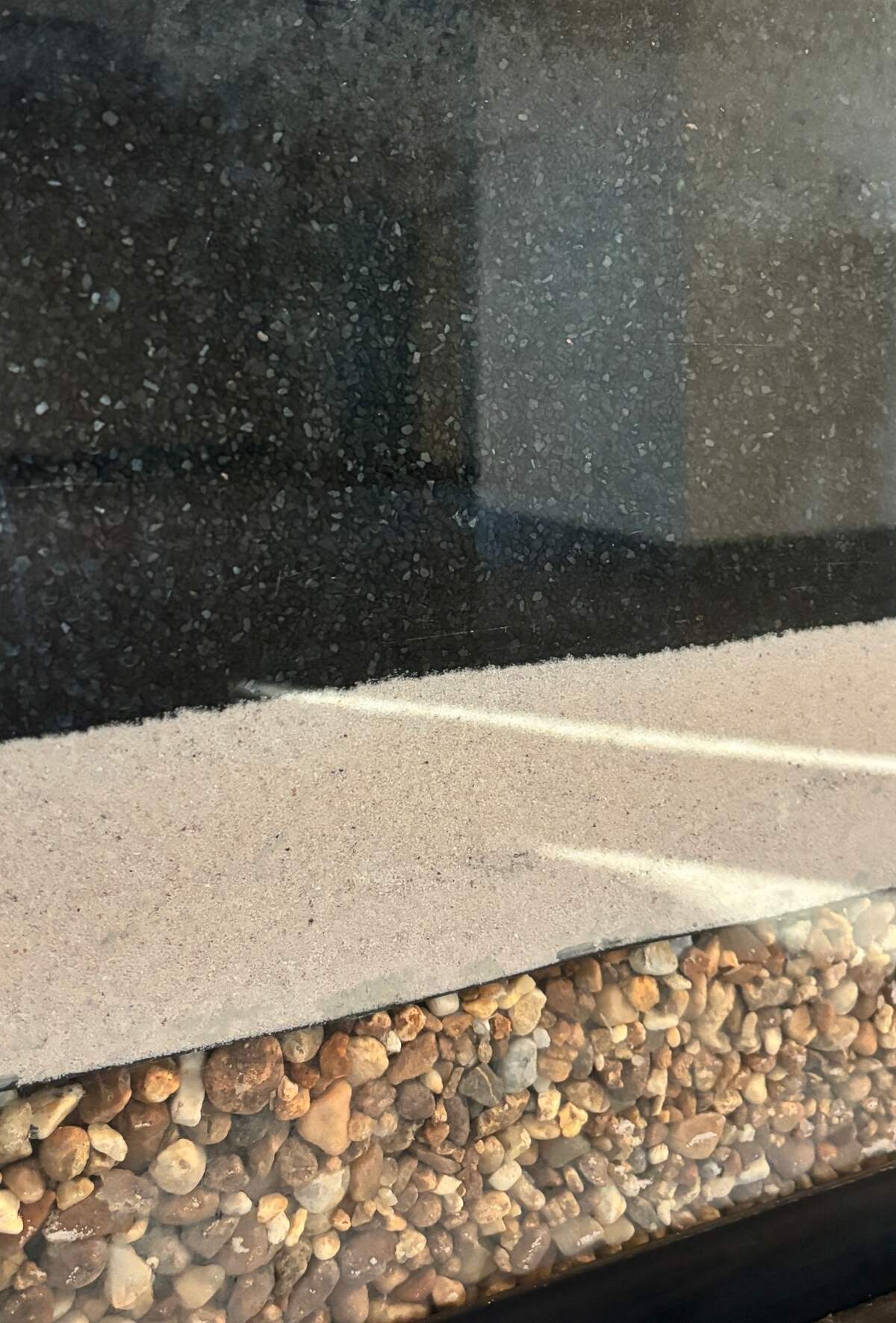 This is what the inside of a GAC filter looks like, with the top-most, thickest layer being the granulated activated carbon which is made from coconut shells.