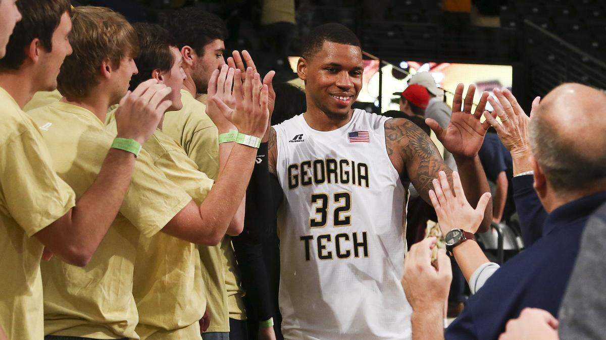 Georgia Tech forward Nick Jacobs (32) celebrates with the fans after the Yellow Jackets' win Monday over Tennessee.