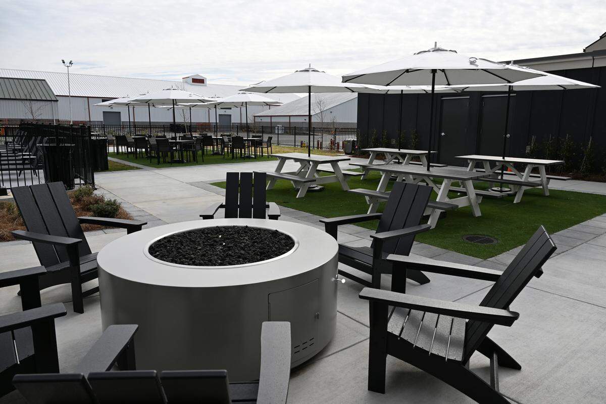 A fire pit and picnic table sit poolside at the Fairfield by Marriott Inn and Suites and TownePlace Suites by Marriott, a new dual-branded hotel at the Georgia National Fairgrounds and Agricenter in Perry, Ga.