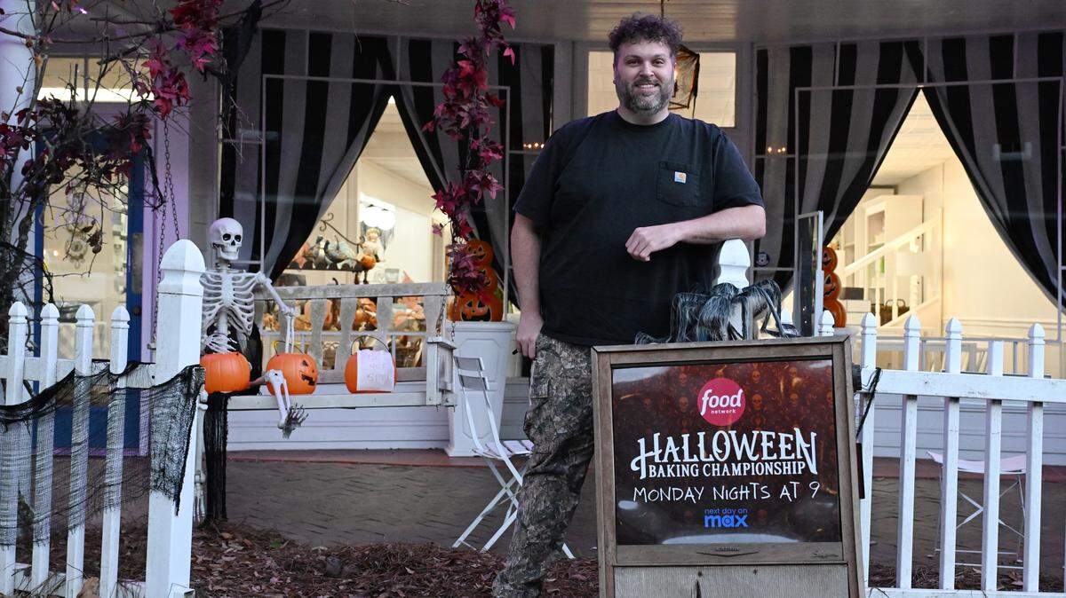 Sweet Evelyn’s owner Cory Jones poses outside of his storefront on Monday, Oct. 20, 2025, in Perry, Georgia. Jones, of Unadilla, advanced to the finale of Food Network’s “Halloween Baking Championship.”