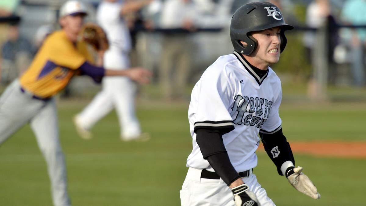JASON VORHEES/THE TELEGRAPH Warner Robins, GA, 03/29/2016: 
 Houston County's Blake Dawson (1) attempts to beat out a sacrifice bunt during their game against Jones County Tuesday.