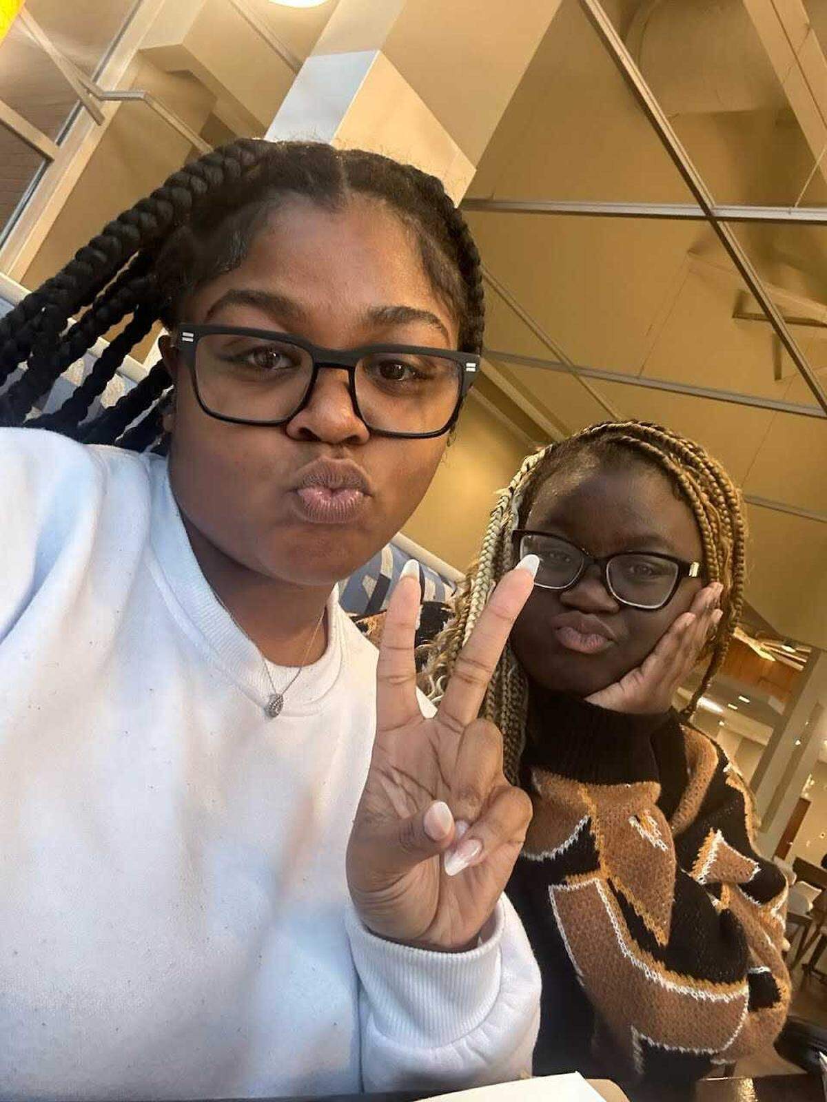 Fort Valley State University alumna Chyua Squires, left, poses with FVSU senior Justice Toomer, who died Jan. 31.