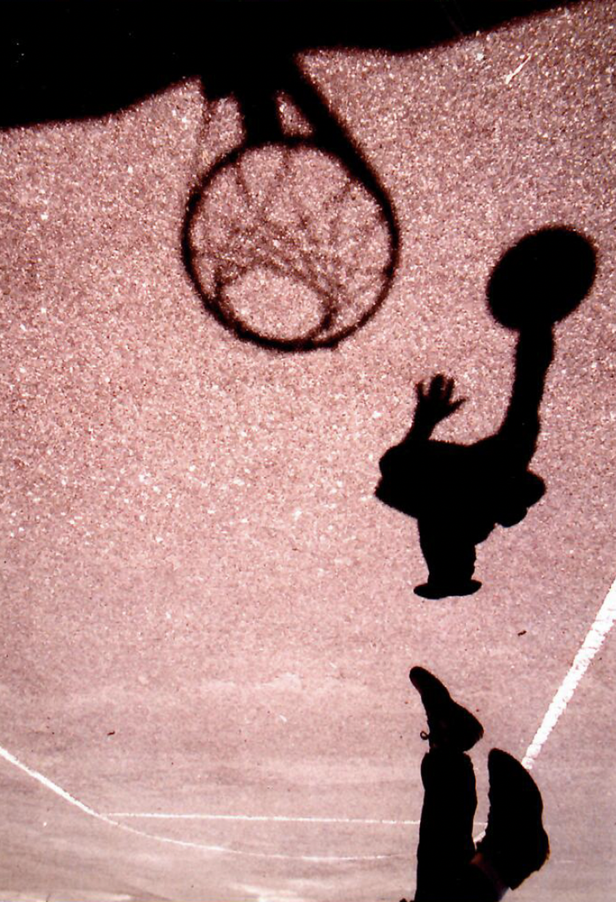 This file photo from former Telegraph photographer Nick Oza shows a young man playing basketball on an outdoor court in Unionville. A framed version of the photo is in Ed Grisamore’s classroom at Stratford.