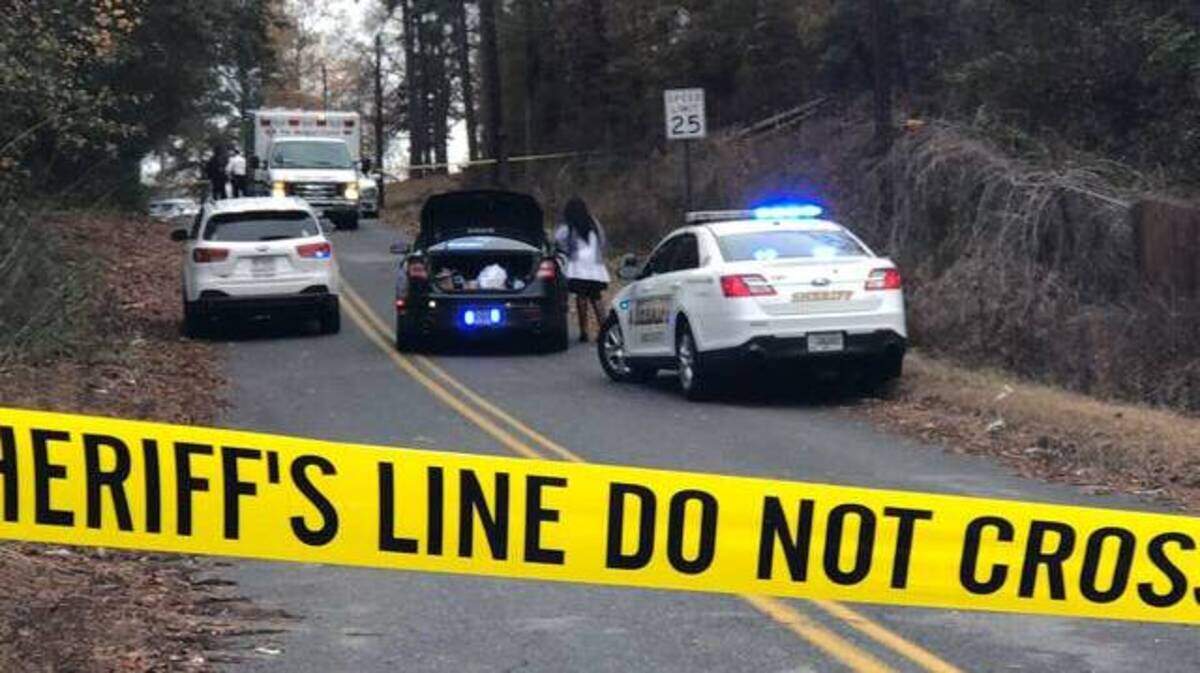 Crime scene tape cordons off Lions Place near where the body of a young man was found Thursday in south Macon.