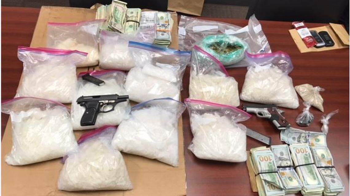 Warner Robins police released Friday this photo of confiscated cash, guns and drugs, including 21 pounds of methamphetamine worth an estimated street value of $789,905, police said.