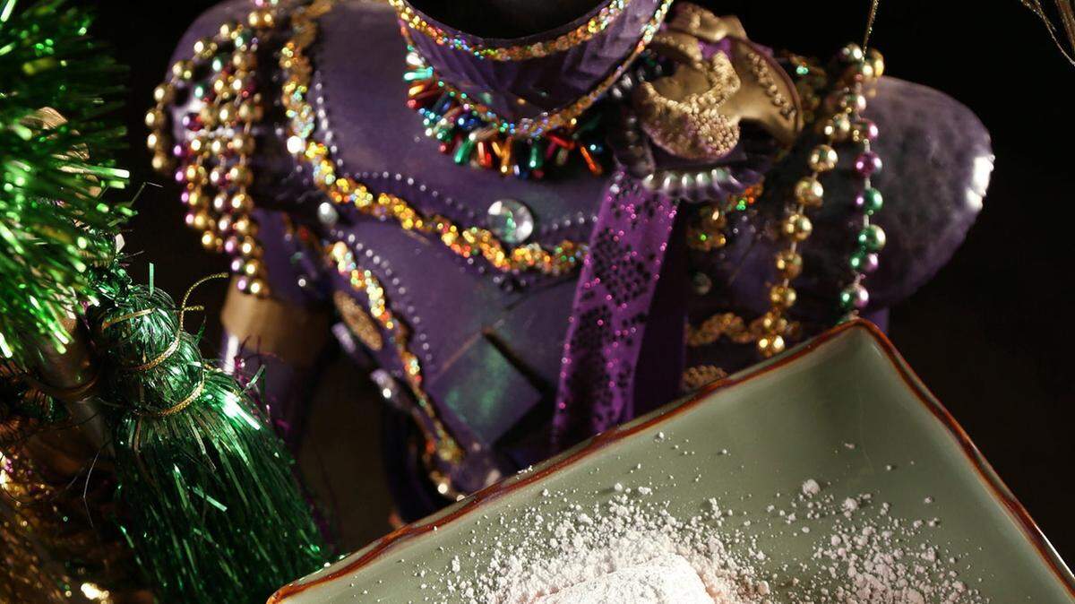 Beignets with a figurine used to decorate multiple Mardi Gras parade floats created by the Mystic Knights of the Purple Haze krewe photographed at Diversified Foam Products in Maplewood, Missouri. 