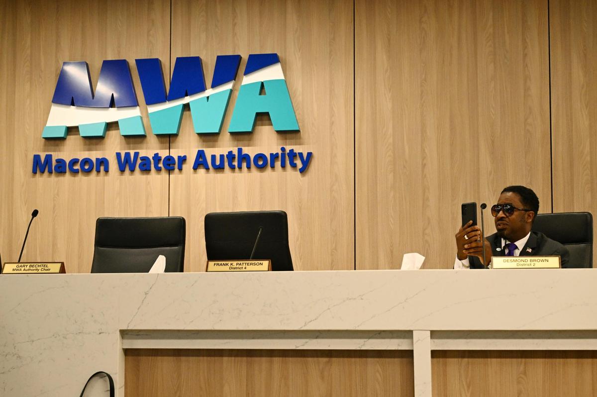 Macon Water Authority District 2 board member Desmond Brown records after all other board members left the room for District 1 board member Elaine Lucas’ separate press conference on allegations against the Macon Water Authority on Thursday, April 17, 2025, at the Macon Water Authority building in Macon, Georgia. Lucas accused other Macon Water Authority members of misusing purchase cards and taking racist actions against her and the only other Black board member Desmond Brown since she was elected to the board this year.