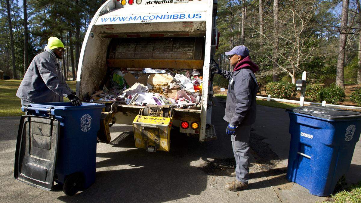 A Macon-Bibb County crew picks up single-stream recycling along South Hillandale Circle.