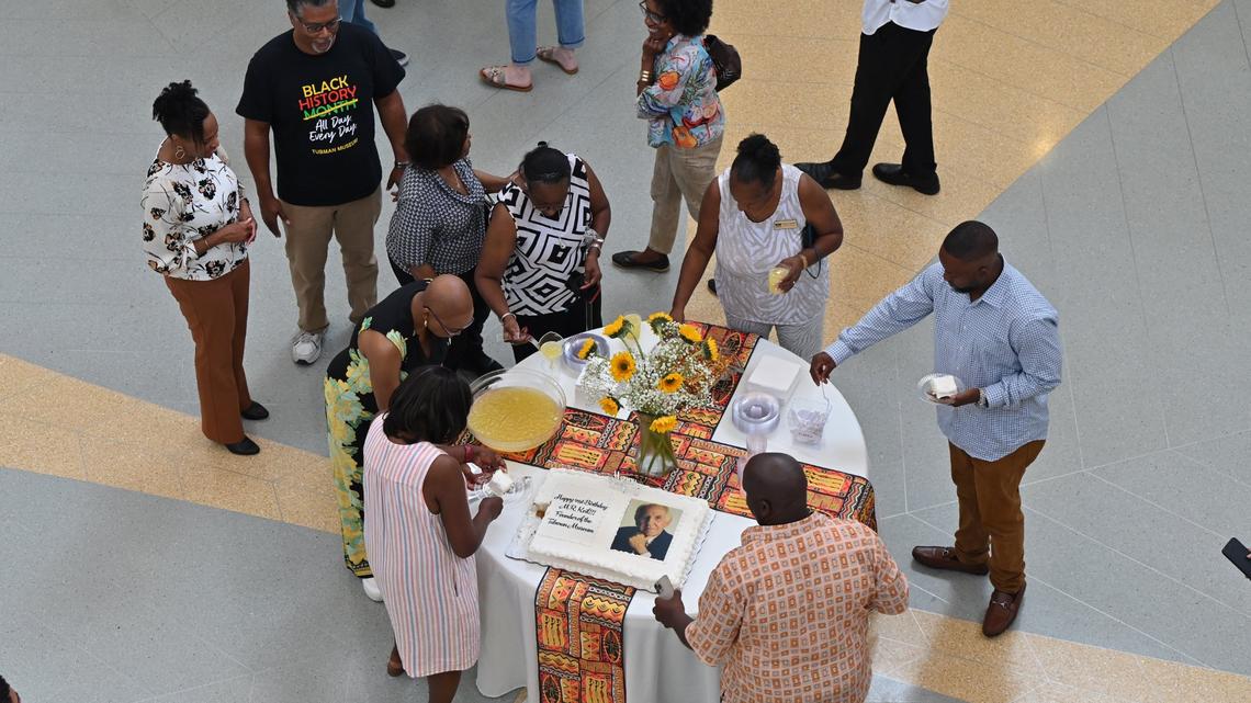 Tubman museum staff and volunteers drink punch and eat cake to celebrate museum founder Richard Keil’s 91st birthday on Friday, May 24, 2024, at the Tubman Museum in Macon, Georgia. Tubman Museum staff and volunteers celebrated Keil’s birthday virtually, as he spoke to those gathered from hospice care.