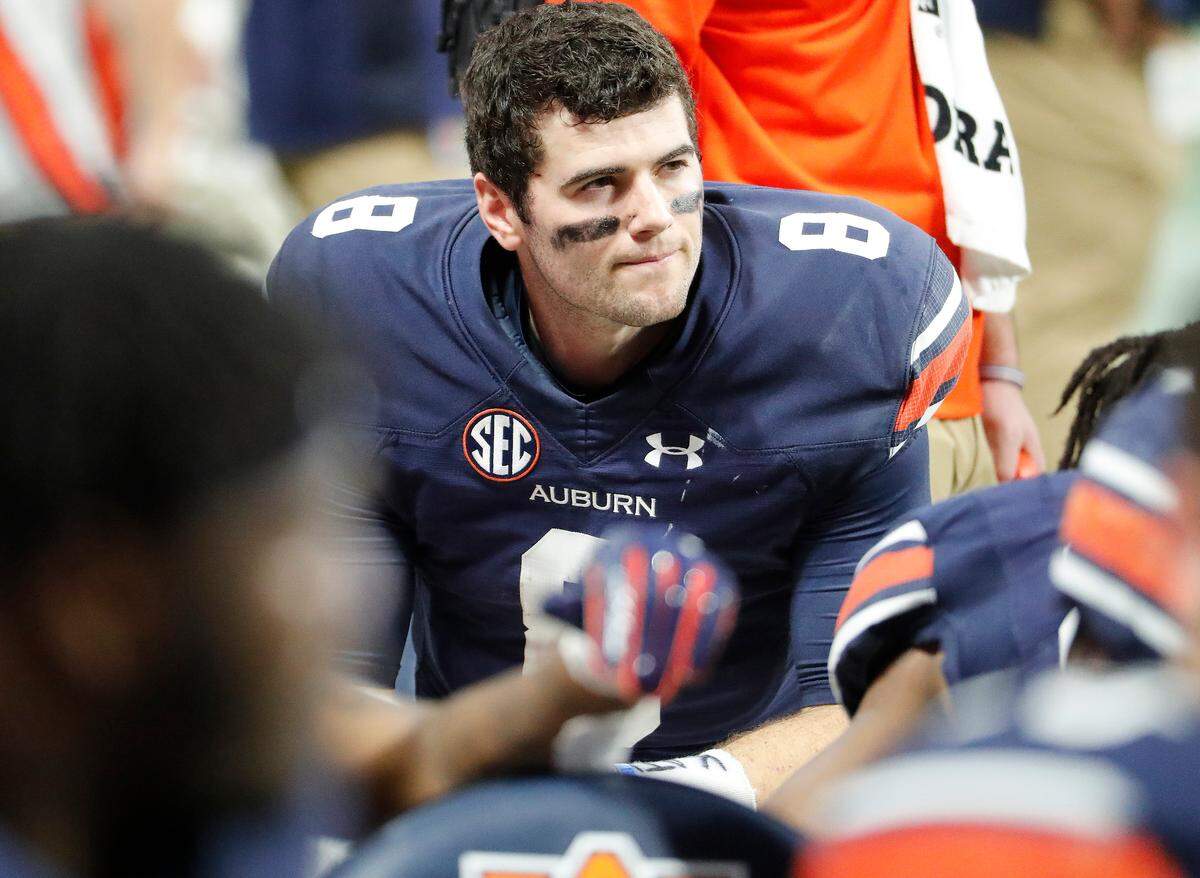 Auburn quarterback Jarrett Stidham (8) gathers with his teammates during the SEC Championship.