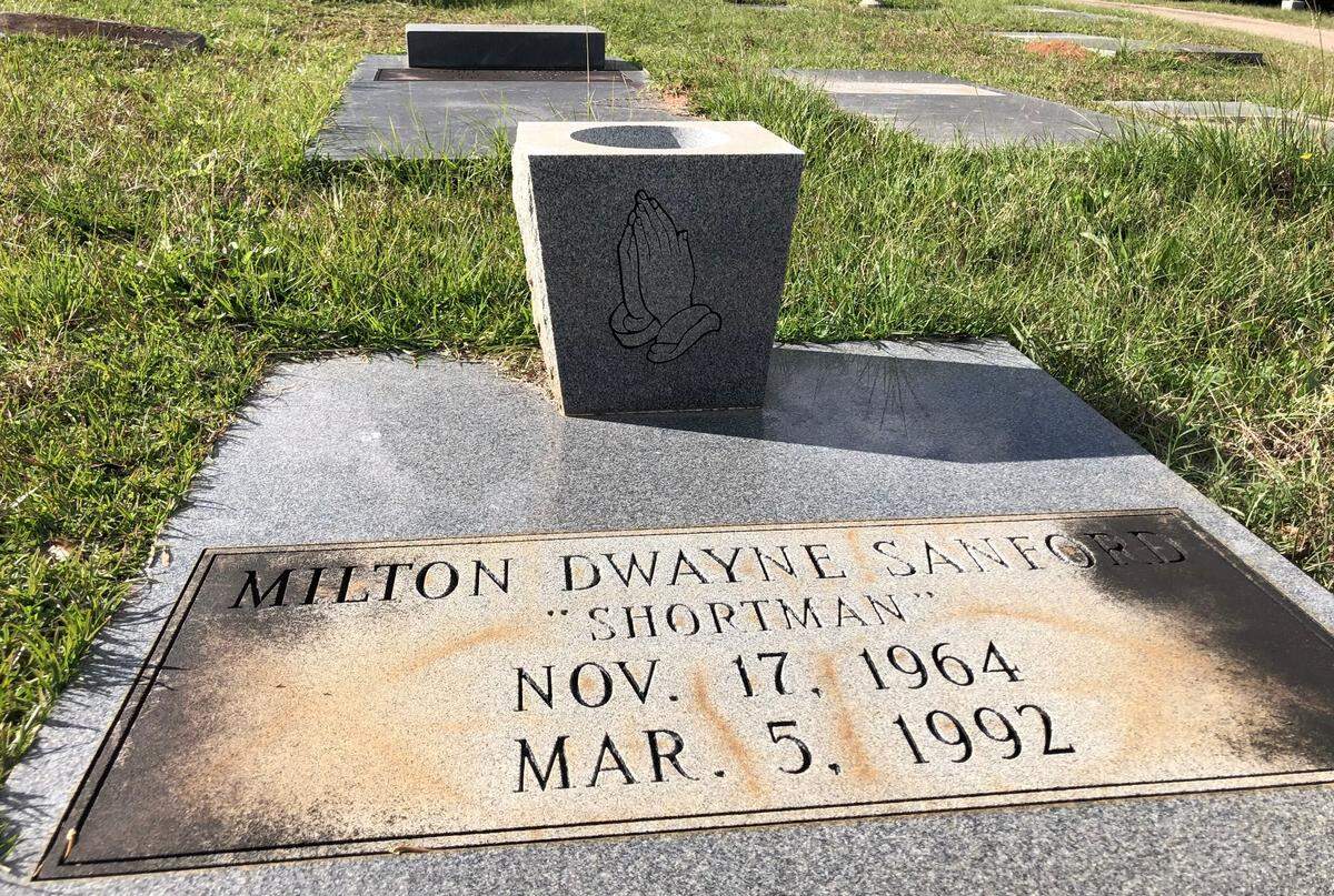 The grave of Milton D. Sanford Sr., who was shot and killed in 1992.