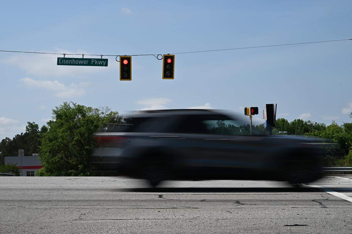 A car drives down Eisenhower Parkway on Monday, May 11, 2026, in Macon, Georgia. A Bibb County man was charged with driving under the influence of alcohol in connection with a pedestrian death on Sunday night at the intersection of Eisenhower Parkway and Heron Street.
