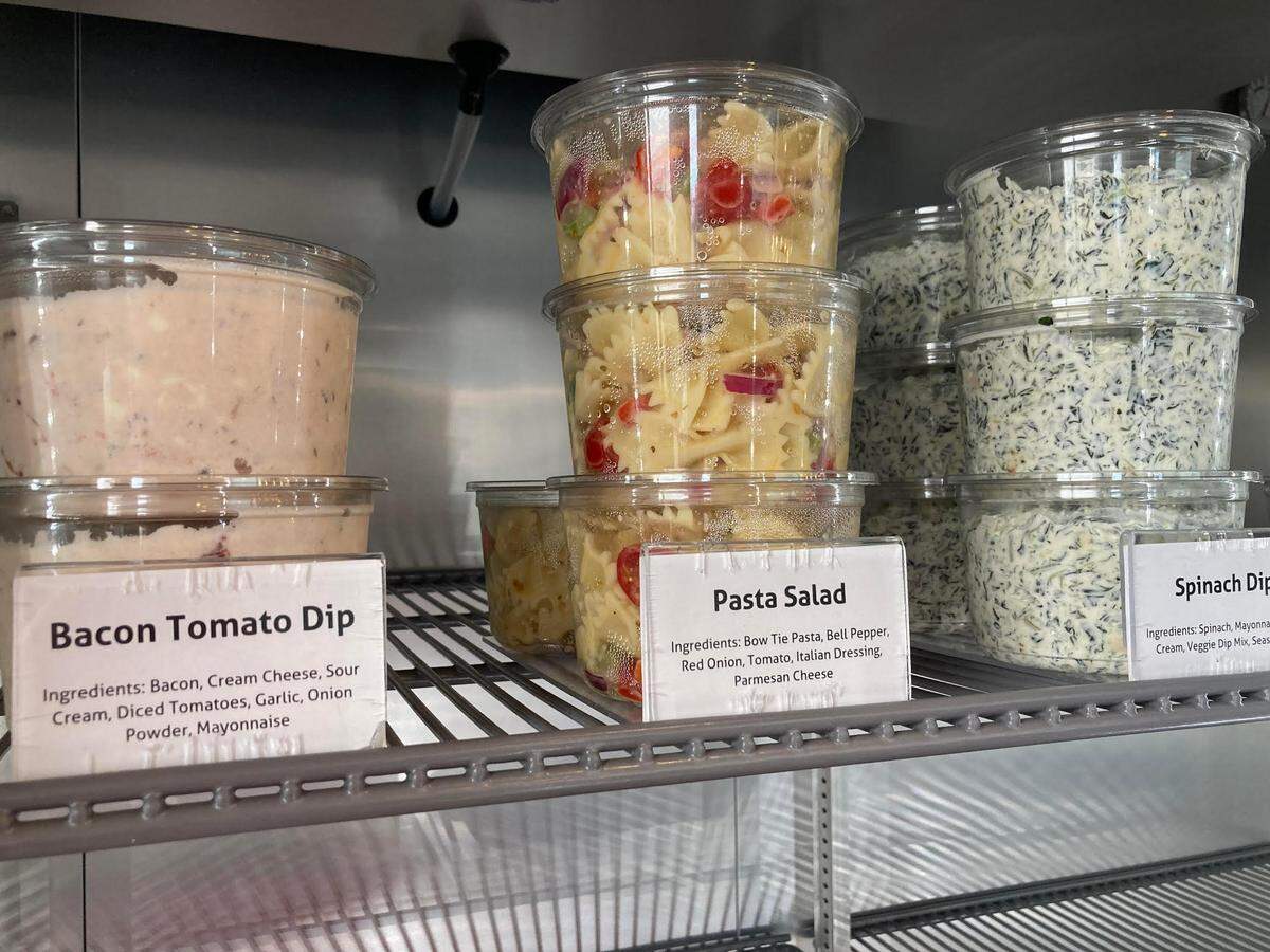 Bacon tomato dip, pasta salad and spinach dip for sale at Acres & Oak Kitchen in Perry. The franchise owners of the Perry location are opening an Acres & Oak Kitchen in Warner Robins.