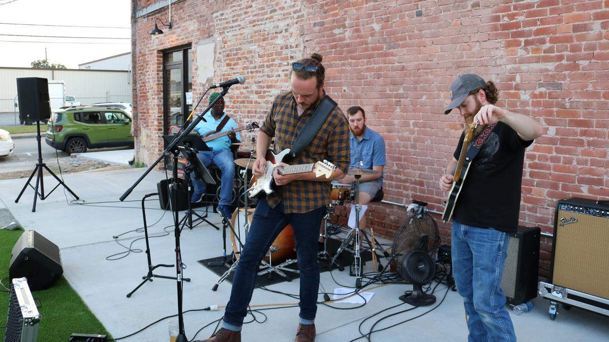 The Blane Dunnam Band sets up before their concert in September. Band members are, from left: Clayton Goodwin, Blane Dunnam, Justin Emerson, and Ramsey Wynee.