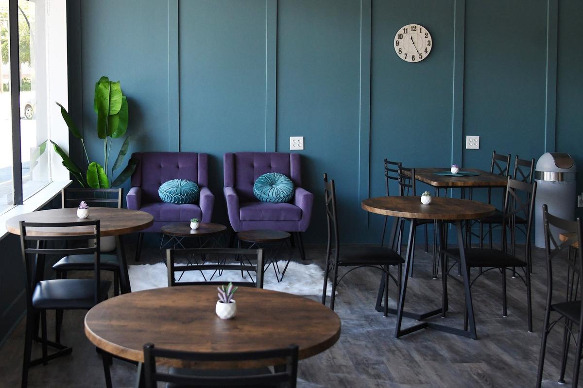 Tables and chairs sit in the cafe space of Paws Awhile Cat Cafe on Thursday, July 11, 2024, in Perry, Georgia. The new cat cafe plans to open this summer and will partner with the Humane Society of Houston County and other rescue groups to have adoptable cats in the cafe.