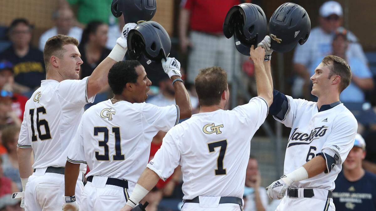 Georgia Tech’s Michael Guldberg, right, celebrates with Kyle McCann (16), Nick Wilhite (31) and Luke Waddell (7) after hitting a three-run home run in the fifth inning against North Carolina State in an NCAA college baseball game in the semifinals of the Atlantic Coast Conference tournament in Durham, N.C., Saturday, May 25, 2019. (Ethan Hyman/The News & Observer via AP)