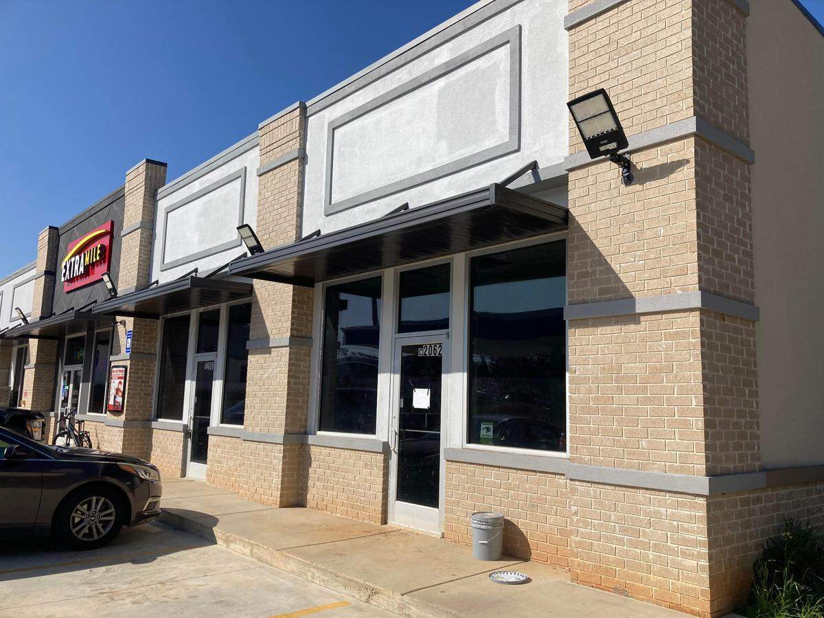 Kitty Corner Spa & Boarding is going into the suite in the far right corner of a shopping strip anchored by an ExtraMile convenience store and Chevron gas station off Watson Boulevard in Warner Robins.