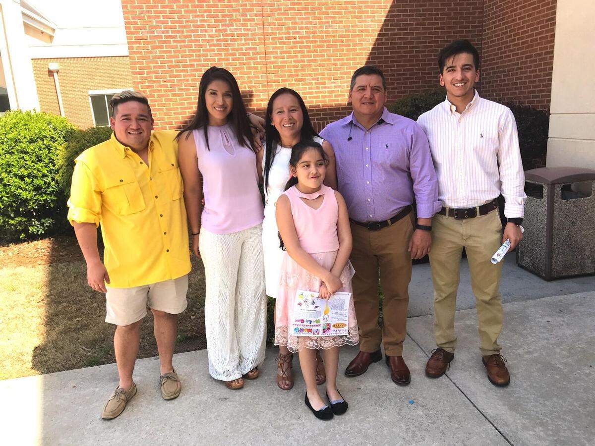 The Alcantar family outside Sacred Heart Catholic Church. From left to right, Andrew, Nayeli, Maria, Bianca (center front), Sergio (Sr.) and Sergio (Jr.).