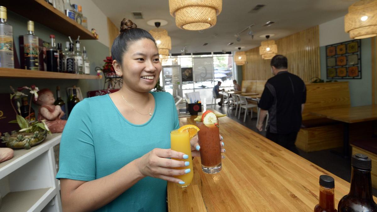 In this July 18, 2018, Telegraph file photo, Jiin Sarrtsud serves up a mimosa and a bloody Mary at Ladda Bistro on Cherry Street where she said the prospect of being allowed to serve alcohol a little earlier on Sunday would suit many of her clientele.  Some Middle Georgia residents voted on the referendum for the Nov. 6 election.