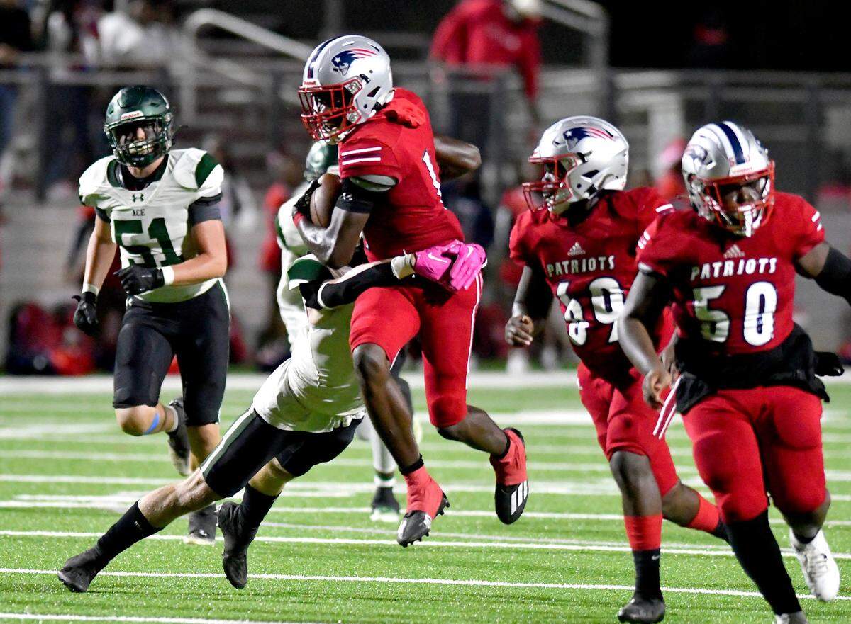 Southwest receiver Carmelo Mays (1) attempts to break a tackle during the Patriots’ 52-51 double overtime win over ACE Thursday night.