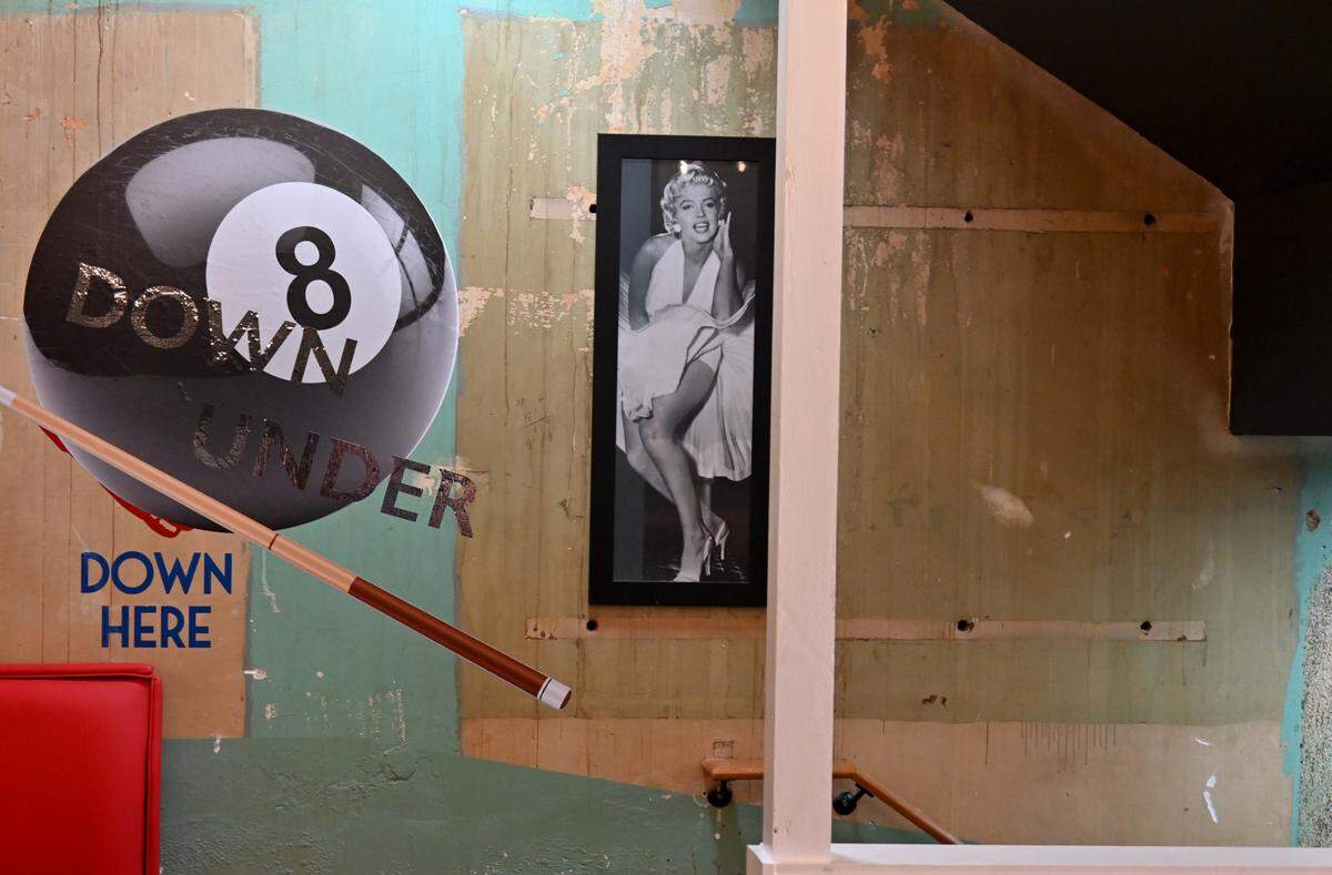 A sign directs customers to the pool hall downstairs at The Brickhouse Pub & Grub located at 458 Second St. in downtown Macon.