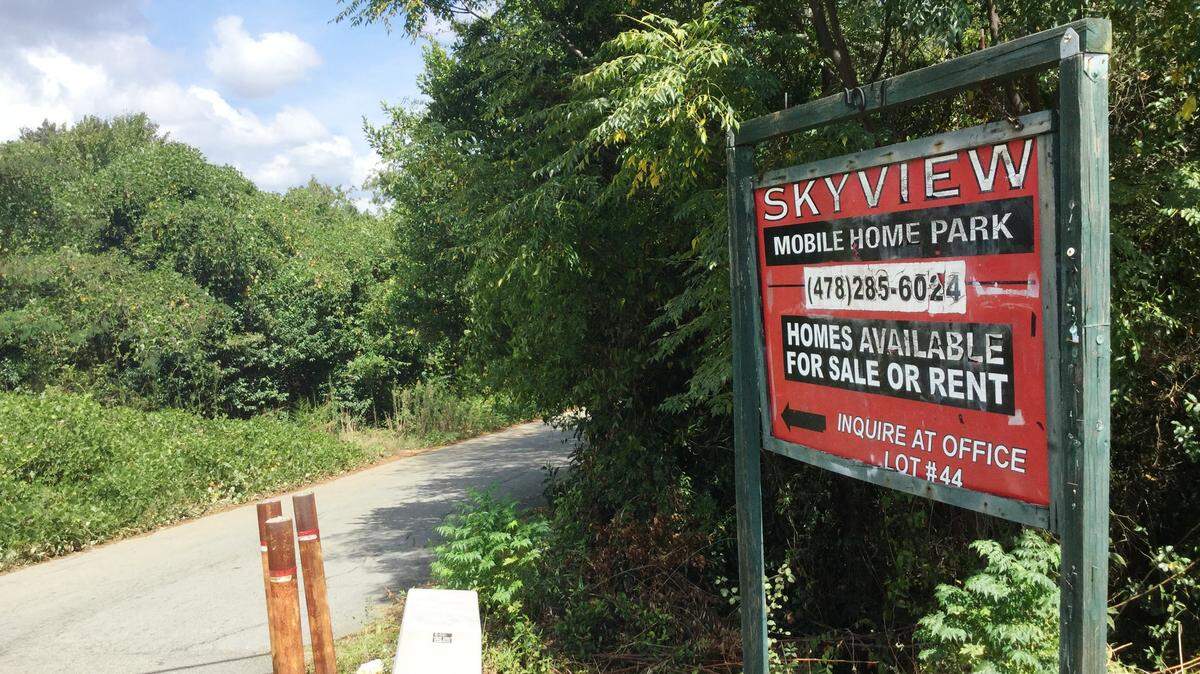 A man out walking his dog just before midnight Friday was shot in a struggle with robbers at Skyview Mobile Home Park off Houston Road in Bibb County.