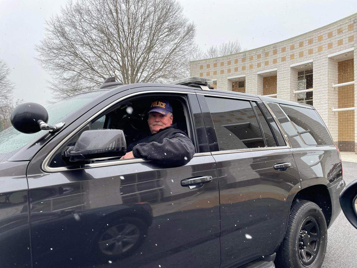Snow dusts the sleeve of Bob Wilbanks, chief of police at Central Georgia Technical College, mid-afternoon Tuesday. Wilbanks was keeping watch over the Warner Robins campus. All CGTC campuses and centers moved to virtual learning Tuesday due to the weather threat.