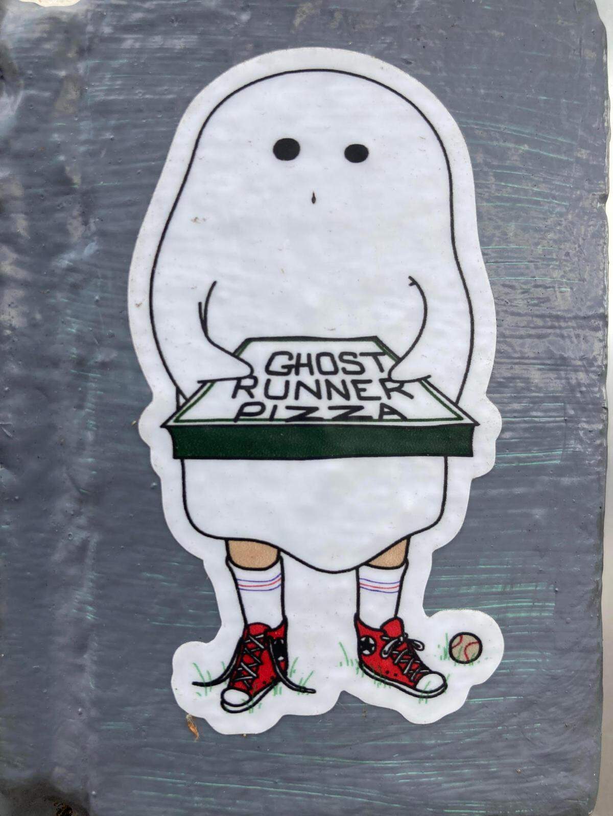 Ghost Runner Pizza is coming to 742 Main St. in downtown Perry. If you’re walking by the future home of the new pizza restaurant, look closely and you’ll find a small logo sticker stuck to the front of the building. This is a photo of it.