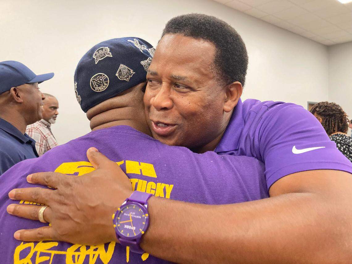 District 7 school board candidate Clyde Jackson gets a hug from a supporter after the Houston County Board of Elections reverses its decision to disqualify him.