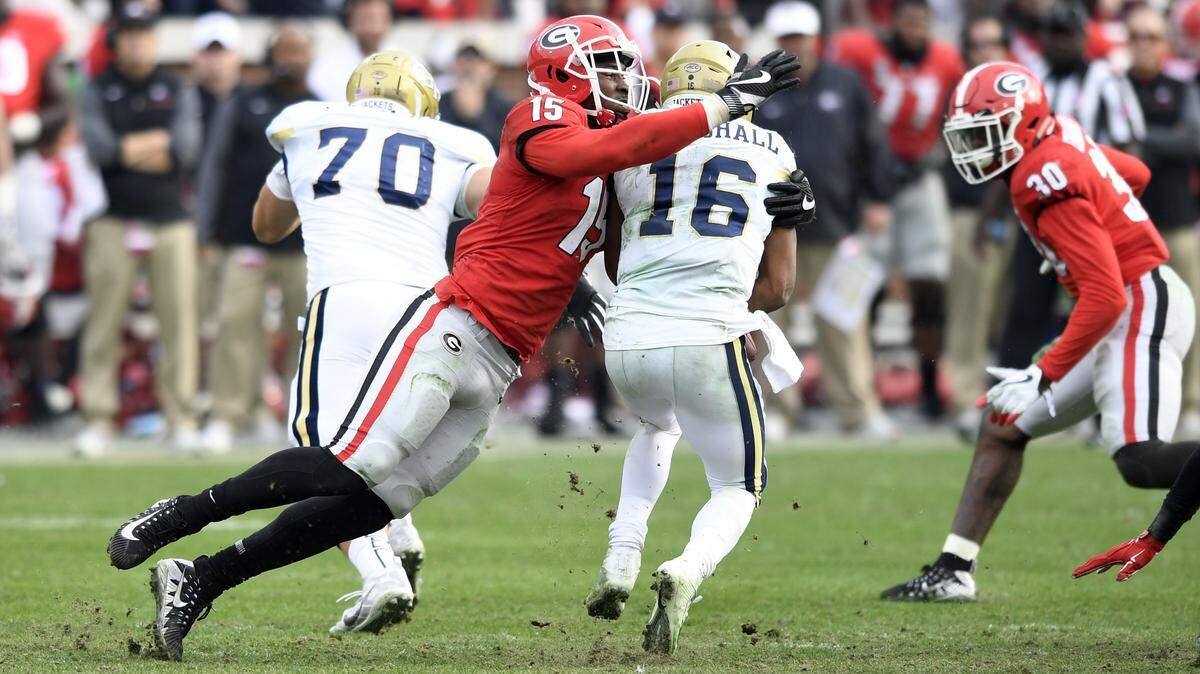Georgia outside linebacker D'Andre Walker tackles Georgia Tech quarterback TaQuon Marshall in a 38-7 victory.