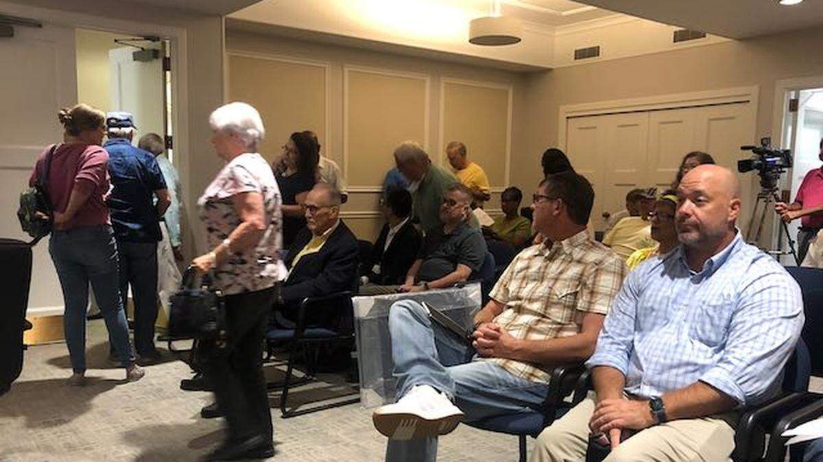 Neighbors in opposition to a proposed business center on Hartley Bridge Road leave Monday’s P&Z meeting when the developer asked for an extension to allow time to meet with neighborhood representatives about the project.