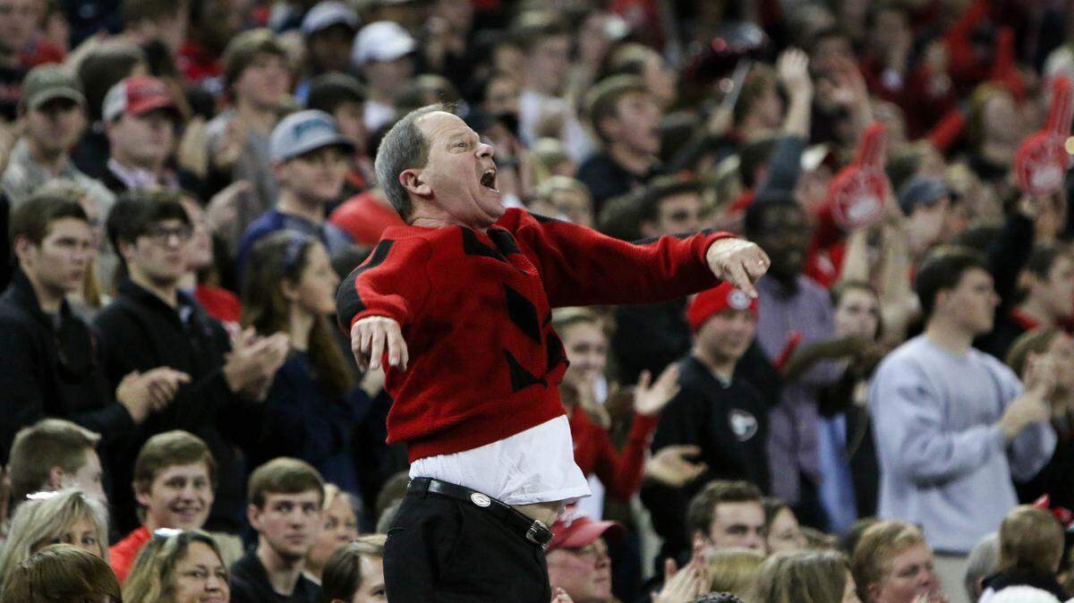 Jesse Kenney, also known as “Sweater Guy” cheers for the team during the Bulldogs’ game at Stegeman Coliseum against the Auburn University in Athens, Ga., on Saturday, Feb. 06, 2016.