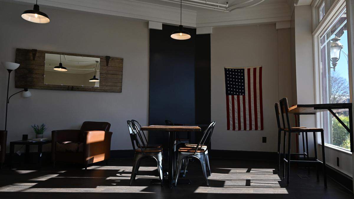 Tables sit inside of the new cafè The Mule Barn on Friday, Jan. 16, 2026, in downtown Macon, Georgia. Owner Dale Fordham said that the majority of the interior is the same from Z Beans Coffee, which she owned and transitioned into the second location of her Cochran based cafè The Mule Barn.