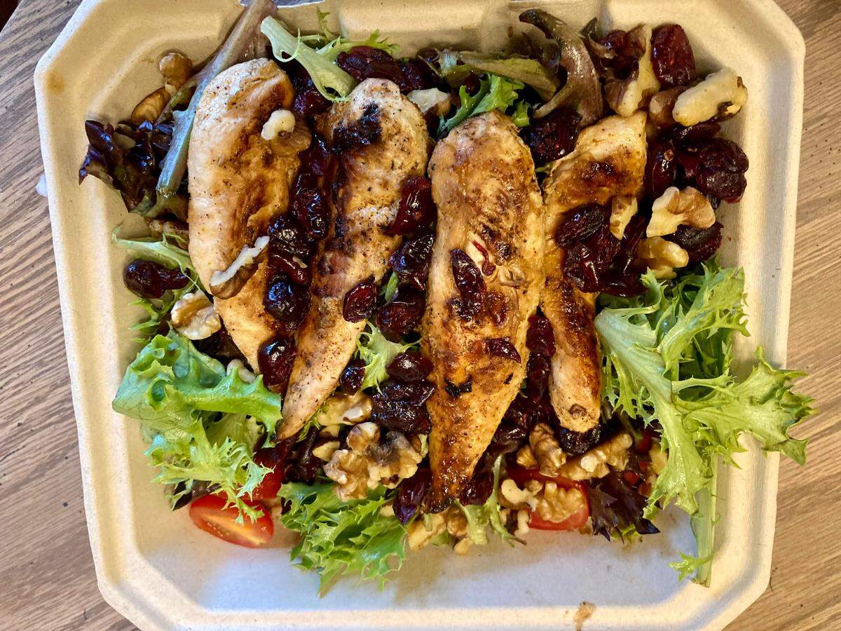 A “Magoo’s Favorite” salad to go from the new Huey Magoo’s Chicken Tenders in Warner Robins. The salad includes grilled chicken tenders, mixed greens, cranberries, walnuts, grape tomatoes and raspberry walnut vinaigrette. The salad dressing, which came on the side, is not pictured above.