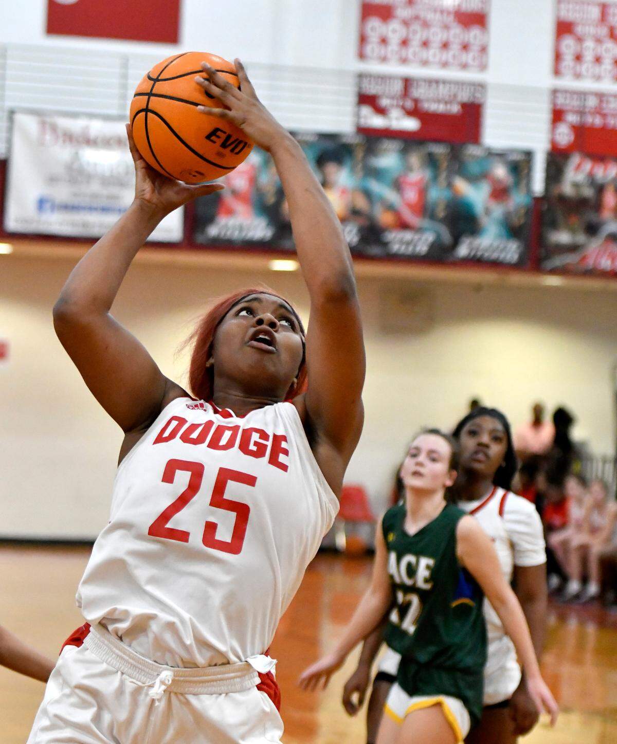 Dodge County’s Lyric Green (25) puts up a shot off the glass during the Indians’ 71-26 win over ACE in the first round of the GHSA playoffs Wednesday.