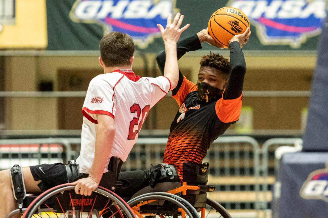 Houston County’s Ger’mir Gordon (4) looks to pass against the Gwinnett Heat in the GHSA Championship March 13.