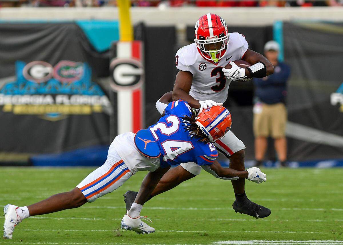 Georgia Running Zamir White breaks a tackle on his way to a first down against the Florida Gators Saturday in Jacksonville.