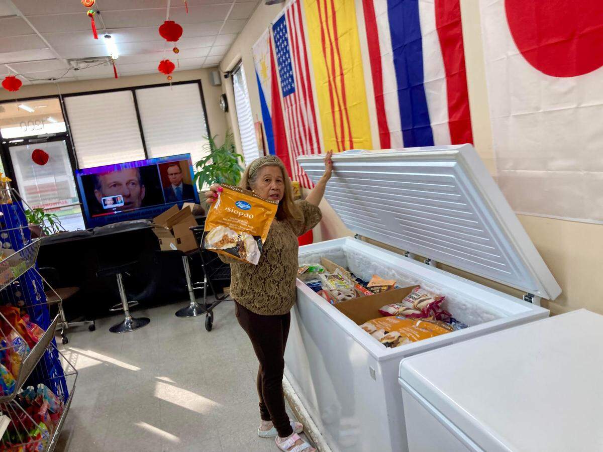 Hermie McMahon, who runs the AB&C Oriental Store in Warner Robins, holds up a frozen package of Magnolia siopao chicken asado steamed buns from the Philippines. McMahon described them as stuffed dumplings.
