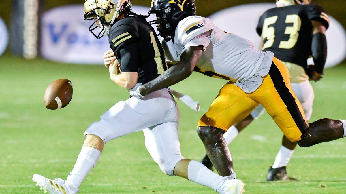 Mary Persons quarterback Logan Hickman (16) is stripped of the ball from Peach County’s Marcus Early Jr. (6) during their Friday night.