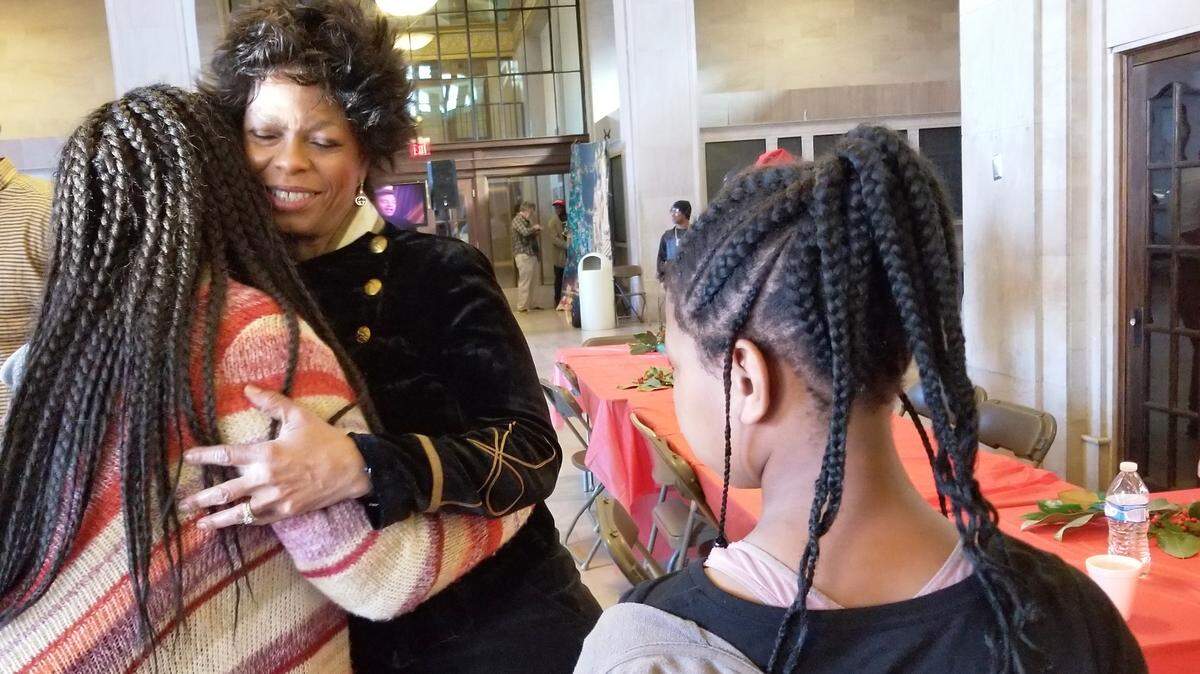 Anita Ponder greets visitors Tuesday to her 23rd Annual Anita Ponder and Friends Christmas Feast held at Terminal Station in Macon on Christmas Day.
